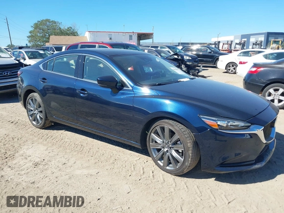 2021 Mazda 6 Grand Touring with VIN JM1GL1TY3M1619771, listed as a IAAI auction lot 40964809 with 25,816 mi miles and . Bid and sale history available at DreamBid. Image 1.