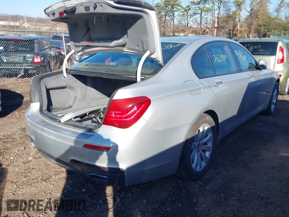 2014 BMW 7 Series 740i with VIN WBAYA6C54ED144450, listed as a IAAI auction lot 41680060 with 999,999 mi miles. Bid and sale history available at carsss.com. Image 4.