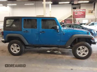 2015 Jeep Wrangler Unlimited Rubicon with VIN 1C4BJWFG7FL661643, listed as a IAAI auction lot 41291385 with 112,785 mi miles. Bid and sale history available at carsss.com. Image 14.
