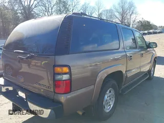 2004 Chevrolet Suburban LS with VIN 1GNEC16Z14J112645, listed as a IAAI auction lot 41699031 with 105,707 mi miles. Bid and sale history available at carsss.com. Image 4.