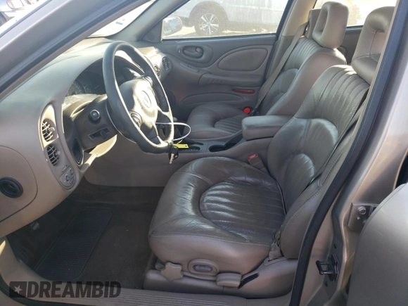 2002 Pontiac Bonneville SLE z VIN 1G2HY54K424205499, wystawiony jako Copart lot #76815334 z przebiegiem 84 715 mil mil oraz Szkoda całkowita • Salvage title. Historia ofert i sprzedaży dostępna na DreamBid. Obrazek 7.