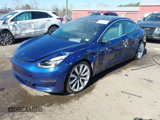 2018 Tesla Model 3 Long Range Battery z VIN 5YJ3E1EB5JF180030, wystawiony jako IAAI lot #41897617 z przebiegiem 89 557 mil mil oraz . Historia ofert i sprzedaży dostępna na DreamBid. Obrazek 19.
