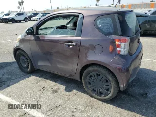 2013 Scion iQ with VIN JTNJJXB05DJ022305, listed as a Copart auction lot 58787155 with 136,046 mi miles and Salvage title. Bid and sale history available at DreamBid. Image 2.