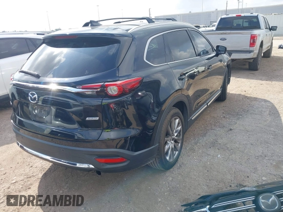 2017 Mazda CX-9 Grand Touring with VIN JM3TCADY5H0129798, listed as a IAAI auction lot 42079754 with 128,403 mi miles and . Bid and sale history available at DreamBid. Image 4.