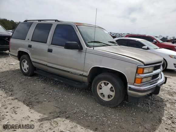 1999 Chevrolet Tahoe with VIN 1GNEC13RXXJ481481, listed as a Copart auction lot 50137645 with 233,418 mi miles and Salvage Title. Bid and sale history available at carsss.com. Image 4.