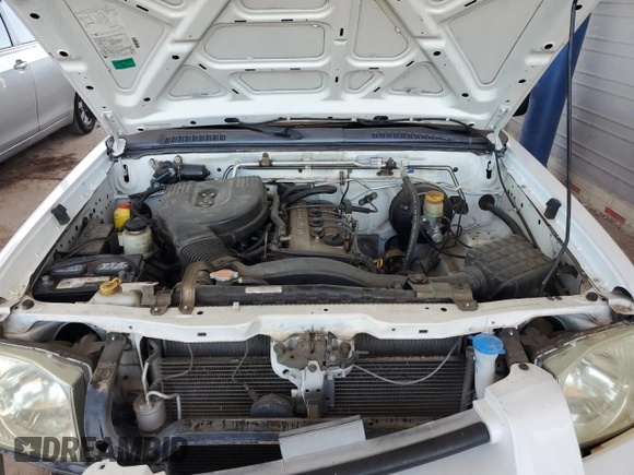 2002 Nissan Frontier XE with VIN 1N6DD26SX2C311752, listed as a Copart auction lot 61182715 with 95,746 mi miles and Salvage title. Bid and sale history available at DreamBid. Image 11.