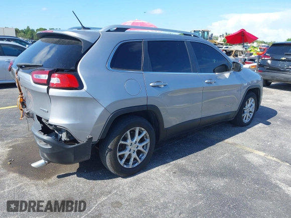 2014 Jeep Cherokee Latitude with VIN 1C4PJLCS6EW103423, listed as a IAAI auction lot 40118289 with 112,120 mi miles and . Bid and sale history available at DreamBid. Image 4.