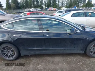 2019 Tesla Model 3 Mid Range with VIN 5YJ3E1EA4KF305611, listed as a IAAI auction lot 41916738 with 59,101 mi miles and . Bid and sale history available at carsss.com. Image 13.