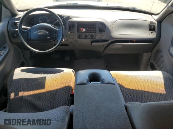 1999 Ford F-150 XL с VIN 1FTRX17L1XKC25356, выставлен на аукционе Copart как лот 65149275 с пробегом 205 482 миль миль и Чистый • Clean title. История ставок и продаж доступна на DreamBid. Изображение 8.