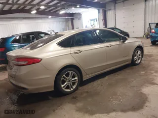 2018 Ford Fusion Hybrid S with VIN 3FA6P0UU5JR100377, listed as a IAAI auction lot 41300284 with 108,936 mi miles. Bid and sale history available at carsss.com. Image 4.