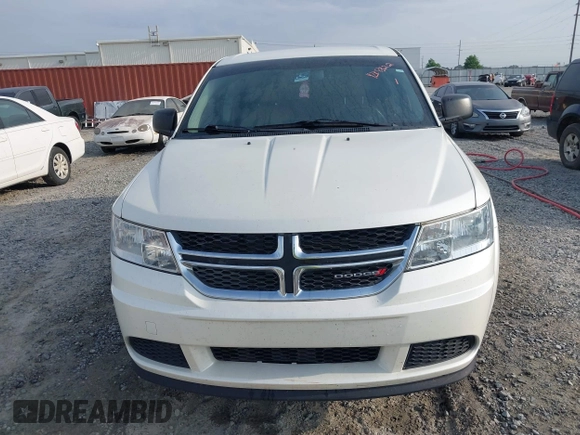 2015 Dodge Journey SE z VIN 3C4PDCAB9FT592689, wystawiony jako IAAI lot #42108322 z przebiegiem 158 140 mil mil oraz . Historia ofert i sprzedaży dostępna na DreamBid. Obrazek 6.