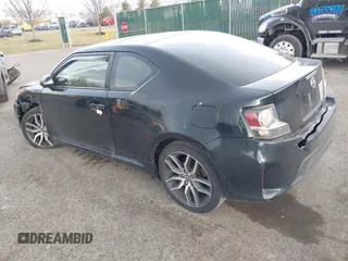 2015 Scion tC with VIN JTKJF5C7XFJ001662, listed as a IAAI auction lot 41843123 with 128,851 mi miles. Bid and sale history available at carsss.com. Image 3.