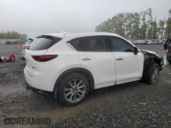 2019 Mazda CX-5 Grand Touring with VIN JM3KFBDM4K0669589, listed as a Copart auction lot 54948455 with 64,475 mi miles and Salvage Title. Bid and sale history available at carsss.com. Image 3.