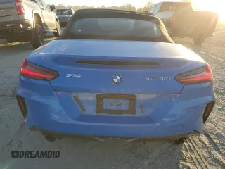 2022 BMW Z4 sDrive30i with VIN WBAHF3C02NWX38818, listed as a Copart auction lot 76604404 with 16,402 mi miles and Salvage Title. Bid and sale history available at carsss.com. Image 6.