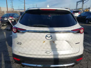 2021 Mazda CX-9 Signature with VIN JM3TCBEY6M0536883, listed as a IAAI auction lot 41388130 with 65,613 mi miles. Bid and sale history available at carsss.com. Image 16.