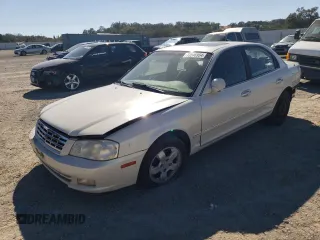 2002 Kia Optima LX z VIN KNAGD126425164168, wystawiony jako Copart lot #73546954 z przebiegiem Nie podano mil oraz Szkoda całkowita • Salvage title. Historia ofert i sprzedaży dostępna na DreamBid. Obrazek 1.