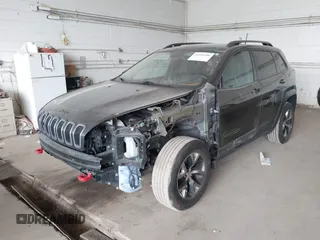 2016 Jeep Cherokee Trailhawk with VIN 1C4PJMBS0GW169184, listed as a IAAI auction lot 42255346 with 152,802 mi miles and . Bid and sale history available at DreamBid. Image 6.