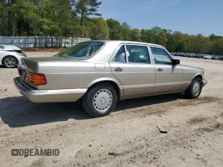 1991 Mercedes-Benz 560 with VIN WDBCA39E9MA599487, listed as a Copart auction lot 51921915 with 59,132 mi miles and Salvage Title. Bid and sale history available at DreamBid. Image 3.