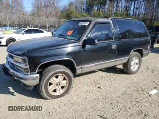 1998 Chevrolet Tahoe z VIN 3GNEK18R9WG123185, wystawiony jako Copart lot #53020915 z przebiegiem 310 261 mil mil oraz Nie do naprawy. Historia ofert i sprzedaży dostępna na DreamBid. Obrazek 1.