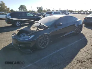 2021 Tesla Model S Long Range z VIN 5YJSA1E50MF438878, wystawiony jako Copart lot #76894084 z przebiegiem Nie podano mil oraz Szkoda całkowita • Salvage title. Historia ofert i sprzedaży dostępna na DreamBid. Obrazek 1.
