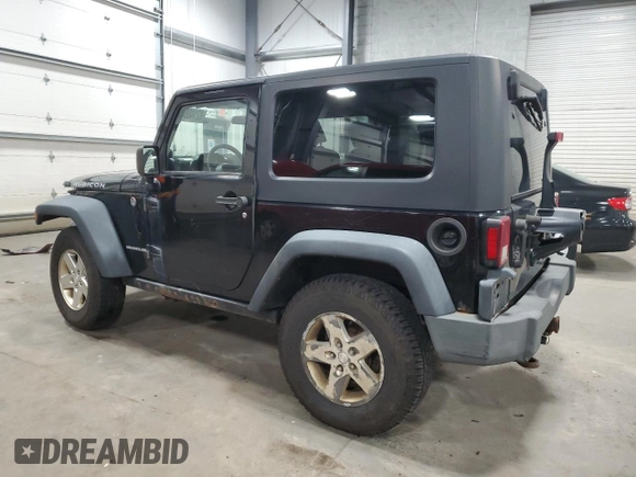 2009 Jeep Wrangler Rubicon with VIN 1J4GA64159L770895, listed as a Copart auction lot 82140864 with 209,464 mi miles and Salvage Title. Bid and sale history available at DreamBid. Image 2.