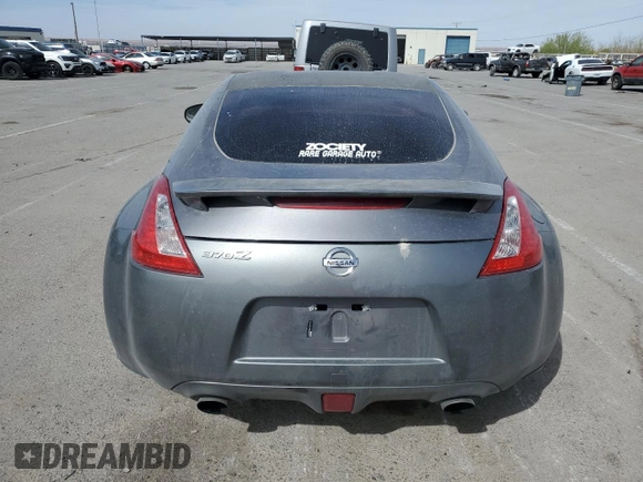 2014 Nissan 370Z z VIN JN1AZ4EH0EM630751, wystawiony jako Copart lot #51489825 z przebiegiem 125 107 mil mil oraz Czysty tytuł • Clean title. Historia ofert i sprzedaży dostępna na DreamBid. Obrazek 6.