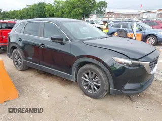 2021 Mazda CX-9 Sport with VIN JM3TCABY6M0522352, listed as a IAAI auction lot 42613136 with 106,167 mi miles and . Bid and sale history available at DreamBid. Image 1.