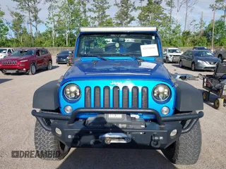 2015 Jeep Wrangler Sport z VIN 1C4AJWAG8FL550859, wystawiony jako IAAI lot #42154946 z przebiegiem 143 658 mil mil oraz . Historia ofert i sprzedaży dostępna na DreamBid. Obrazek 13.