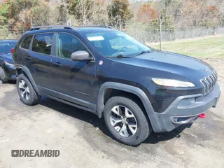2014 Jeep Cherokee Trailhawk with VIN 1C4PJMBB6EW162303, listed as a IAAI auction lot 41910167 with 133,669 mi miles. Bid and sale history available at carsss.com. Image 1.