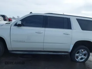 2015 Chevrolet Suburban LT with VIN 1GNSKJKC0FR309866, listed as a IAAI auction lot 41743848 with 220,778 mi miles and . Bid and sale history available at DreamBid. Image 14.