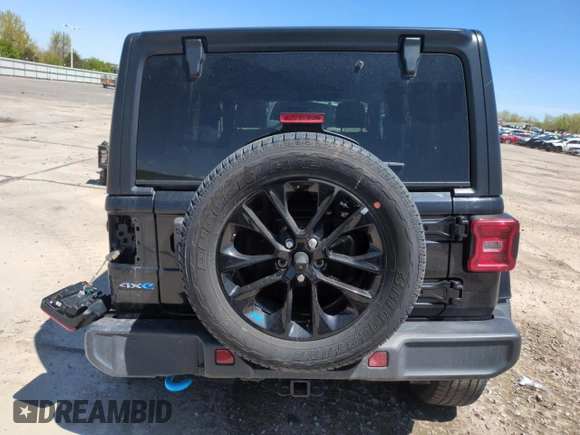 2023 Jeep Wrangler Sahara with VIN 1C4JJXP65PW661194, listed as a Copart auction lot 55729925 with 24,264 mi miles and Clean Title. Bid and sale history available at DreamBid. Image 6.