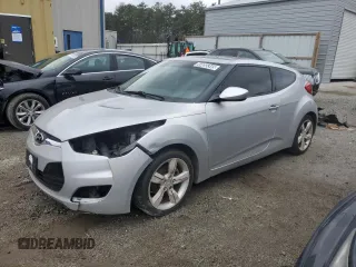 2012 Hyundai Veloster w/Red Int with VIN KMHTC6AD2CU021143, listed as a Copart auction lot 44055345 with Not provided miles and Clean title. Bid and sale history available at DreamBid. Image 1.
