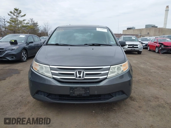 2012 Honda Odyssey EX-L with VIN 5FNRL5H65CB042898, listed as a IAAI auction lot 41784075 with 179,596 mi miles and . Bid and sale history available at carsss.com. Image 12.
