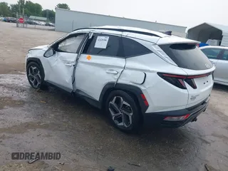 2022 Hyundai Tucson SEL z VIN 5NMJC3AE3NH057663, wystawiony jako IAAI lot #42428386 z przebiegiem 78 740 mil mil oraz . Historia ofert i sprzedaży dostępna na DreamBid. Obrazek 3.