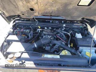 2007 Jeep Wrangler Unlimited Sahara with VIN 1J4GA59197L141821, listed as a Copart auction lot 76897044 with 124,070 mi miles and Salvage title. Bid and sale history available at DreamBid. Image 12.