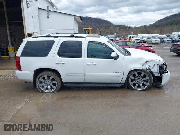 2013 Chevrolet Tahoe LT with VIN 1GNSKBE05DR293054, listed as a IAAI auction lot 41955877 with 192,474 mi miles and . Bid and sale history available at DreamBid. Image 14.