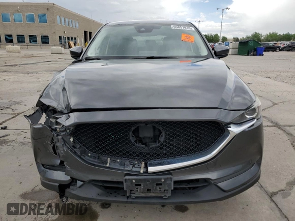 2018 Mazda CX-5 Touring z VIN JM3KFBCM4J0349687, wystawiony jako Copart lot #55857945 z przebiegiem Nie podano mil oraz Szkoda całkowita • Salvage title. Historia ofert i sprzedaży dostępna na DreamBid. Obrazek 5.