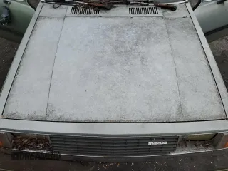 1981 Mazda 626 z VIN JM1GB2216B0531636, wystawiony jako Copart lot #85505404 z przebiegiem 41 816 mil mil oraz Szkoda całkowita • Salvage title. Historia ofert i sprzedaży dostępna na DreamBid. Obrazek 11.