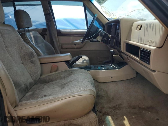 1995 Jeep Cherokee Country with VIN 1J4FJ78S4SL631318, listed as a Copart auction lot 63087634 with 295,577 mi miles and Salvage Title. Bid and sale history available at carsss.com. Image 7.