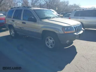 1999 Jeep Grand Cherokee Laredo with VIN 1J4GW58S4XC787702, listed as a IAAI auction lot 41663680 with 177,256 mi miles. Bid and sale history available at carsss.com. Image 1.