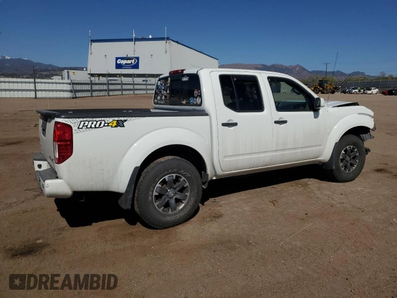 2018 Nissan Frontier Pro-4X with VIN 1N6AD0EV1JN715111, listed as a Copart auction lot 54012255 with 127,409 mi miles and Salvage title. Bid and sale history available at DreamBid. Image 3.