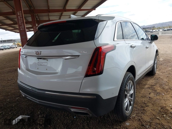 2021 Cadillac XT5 FWD Premium Luxury with VIN 1GYKNCRS5MZ224957, listed as a IAAI auction lot 41794648 with 28,540 mi miles and . Bid and sale history available at carsss.com. Image 4.