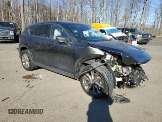 2021 Mazda CX-5 Grand Touring with VIN JM3KFBDM1M0489859, listed as a Copart auction lot 48688905 with 36,882 mi miles and Salvage Title. Bid and sale history available at DreamBid. Image 4.