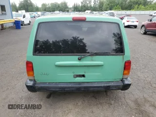 1999 Jeep Cherokee SE with VIN 1J4FF28SXXL641556, listed as a Copart auction lot 62605065 with Not provided miles and Salvage title. Bid and sale history available at DreamBid. Image 6.