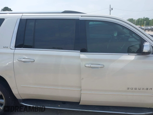 2015 Chevrolet Suburban LTZ with VIN 1GNSCKKC5FR740352, listed as a IAAI auction lot 39075234 with 112,945 mi miles and . Bid and sale history available at DreamBid. Image 14.
