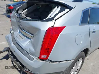 2011 Cadillac SRX Luxury Collection z VIN 3GYFNAEY9BS642724, wystawiony jako IAAI lot #42067396 z przebiegiem 177 473 mil mil oraz . Historia ofert i sprzedaży dostępna na DreamBid. Obrazek 11.