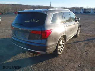2017 Honda Pilot Touring with VIN 5FNYF6H94HB078642, listed as a IAAI auction lot 41621098 with 61,338 mi miles. Bid and sale history available at carsss.com. Image 4.