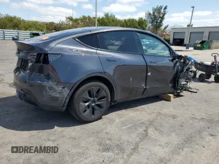 2025 Tesla Model Y Long Range with VIN 7SAYGDED8SF241779, listed as a Copart auction lot 51899205 with 12,409 mi miles and Salvage Title. Bid and sale history available at DreamBid. Image 3.