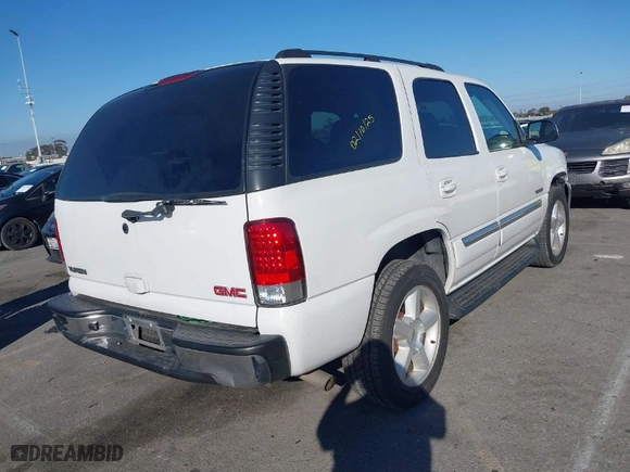 2004 GMC Yukon SLT with VIN 1GKEC13T64R289853, listed as a IAAI auction lot 41668408 with 163,829 mi miles. Bid and sale history available at carsss.com. Image 4.
