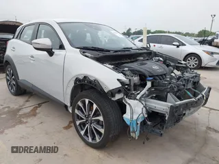 2019 Mazda CX-3 Touring z VIN JM1DKDC71K1420987, wystawiony jako IAAI lot #42153379 z przebiegiem 85 292 mil mil oraz . Historia ofert i sprzedaży dostępna na DreamBid. Obrazek 1.